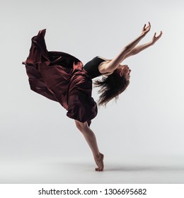 Young beautiful dancer posing in studio