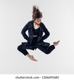 Young beautiful dancer posing in studio