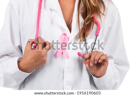 young beautiful doctor woman with pink stethoscope and pink awareness ribbon for breast cancer on a white background.