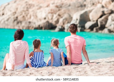 Young Beautiful Family On The Beach