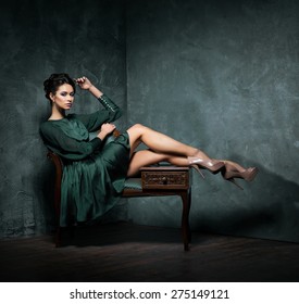 Young And Beautiful Fashion Model Over Vintage And Shabby Background