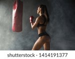 Young Beautiful Female Boxer Posing Fight Position Punching Bag