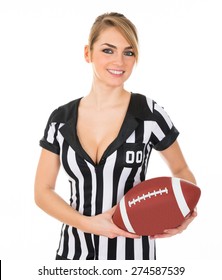 Young Beautiful Female Referee Holding American Football