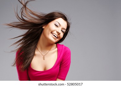 young beautiful female teenager with flying hair