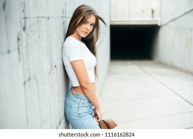 Young beautiful girl in city urban location 