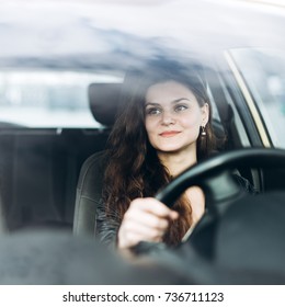 Young Beautiful Girl Driving A Car