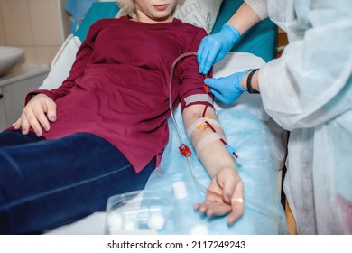 Young beautiful girl, during hemodialysis in hospital, dialysis system equipment, habitual routine for chronic patient, lifestyle, medical concept