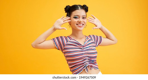 Young Beautiful Girl With Fancy Hairdo In Casual Outfit