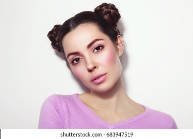 Young Beautiful Girl With Fancy Hairdo In Casual Outfit 