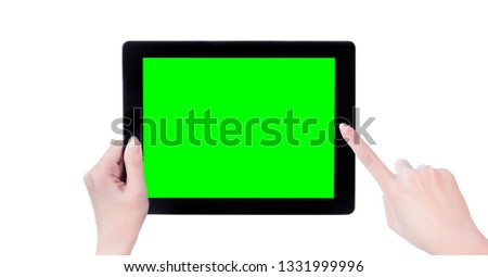 Young beautiful girl holding a black tablet pc template with green screen isolated on white background, close up, mock up, clipping path, cut out