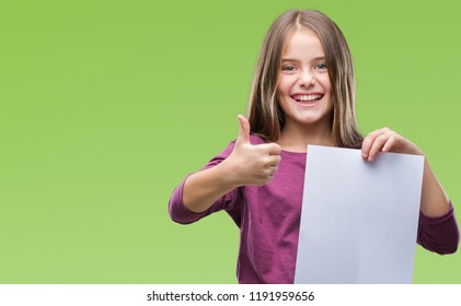 Young Beautiful Girl Holding Blank Sheet Paper Over Isolated Background Happy With Big Smile Doing Ok Sign, Thumb Up With Fingers, Excellent Sign