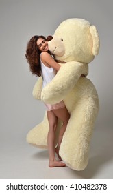 giant teddy bear with girl
