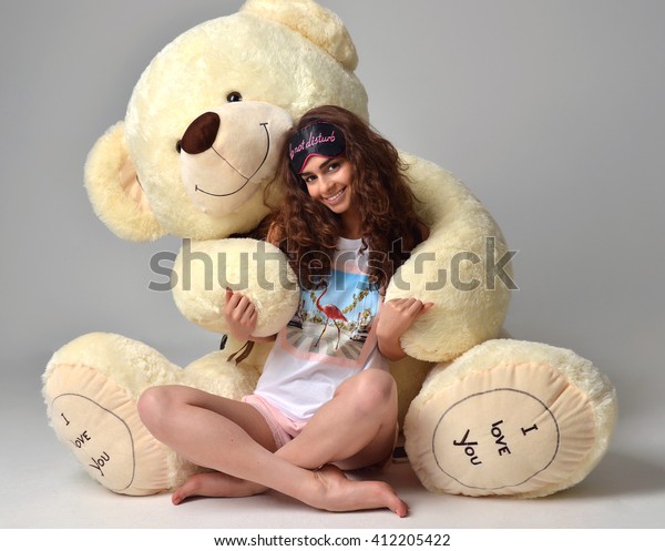 hugging giant teddy bear