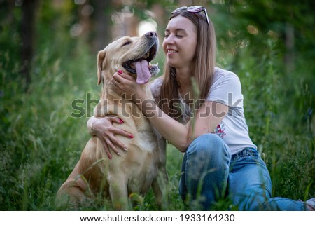 Similar – Happy smiling dog with its pretty young owner