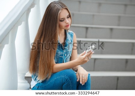 Similar – Image, Stock Photo Blonde woman looking at her smartphone outdoors