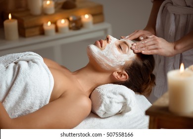 Young Beautiful Girl In Mask For Face Relaxing In Spa Salon.