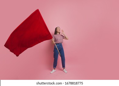 Young And Beautiful Girl With A Red Flag On A Pink Background. A Socially Active Woman, To Protest And Fight For Rights ,the Concept