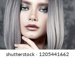 Young beautiful girl with silver make-up and ash hair. Beauty close-up portrait