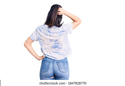 Young Beautiful Girl Wearing Casual T Shirt Backwards Thinking About Doubt With Hand On Head 