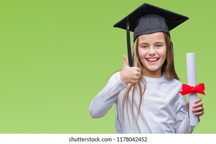 Young beautiful girl wearing graduate cap holding degree over isolated background happy with big smile doing ok sign, thumb up with fingers, excellent sign - Powered by Shutterstock