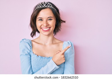 Young beautiful girl wearing princess crown smiling with a happy and cool smile on face. showing teeth.  - Powered by Shutterstock