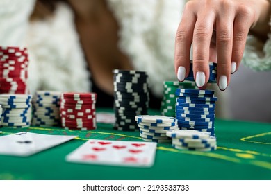 Young Beautiful Girl Won In Poker And Takes All The Chips With Her Own Hands. Playing Casino Or Poker. Raising Rates Or Gambling Business