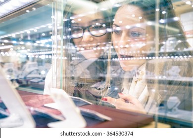 Young Beautiful Girlfriends At Jewellery Store - Best Friends Sharing Free Time Having Fun At Shopping Mall - People Enjoying Everyday Life Moments - Shallow Depth Of Field With Focus On Woman At Left