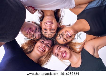 Similar – Young people with their heads together having fun