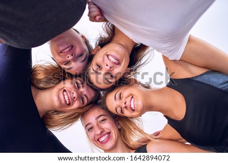 Similar – Young people with their heads together having fun