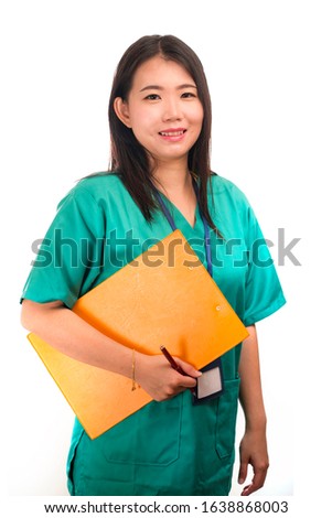 young beautiful and happy Asian Korean medicine doctor woman or hospital nurse in green scrubs posing cheerful smiling confident in corporate clinic staff portrait on isolated white background