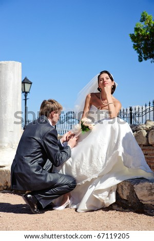 Young beautiful happy married couple outdoors