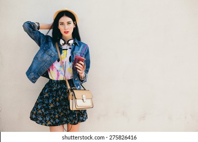 Young Beautiful Happy Stylish Hipster Girl, Cocktail, Smoozy Drink, Denim Jacket, Smiling, Fashion, Teen, Cool Accessories, Purse, Hat, Sunglasses, Amazed, Vintage Style Outfit, Wall Background