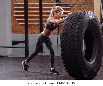 Young Beautiful Healthy Woman Has Performed G Exercise With Tractor Tire. Side View Full. Success In Sport