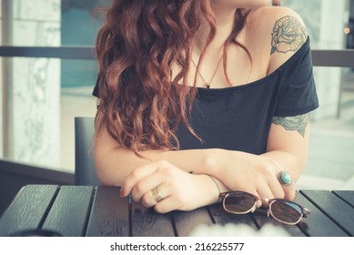 Young Beautiful Hipster Woman With Red Curly Hair At The Bar