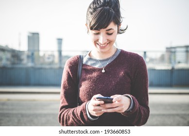 Young Beautiful Hipster Woman Using Smart Phone In The City