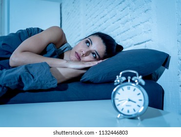 young beautiful hispanic woman at home bedroom lying in bed late at night trying to sleep suffering insomnia sleeping disorder or scared on nightmares looking sad worried in mental health concept - Shutterstock ID 1132446803