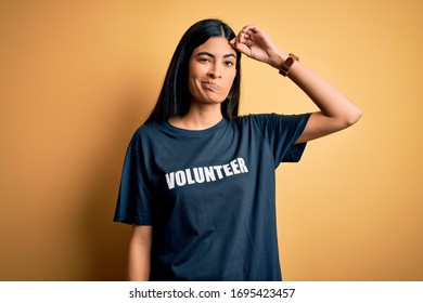 Young Beautiful Hispanic Woman Wearing Volunteer T-shirt As Social Charity Moral Worried And Stressed About A Problem With Hand On Forehead, Nervous And Anxious For Crisis