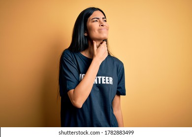 Young Beautiful Hispanic Woman Wearing Volunteer T-shirt As Social Charity Moral Touching Painful Neck, Sore Throat For Flu, Clod And Infection