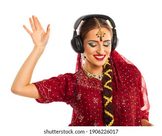 Young Beautiful Indian Woman Listening To Music On Headphones