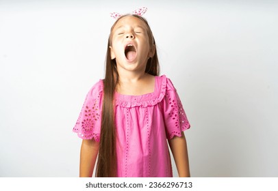 Young beautiful kid girl wearing pink dress angry and mad screaming frustrated and furious, shouting with anger. Rage and aggressive concept. - Shutterstock ID 2366296713