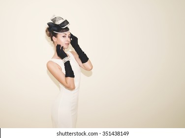 Young  Beautiful Lady Dressed In A Proper Outfit For Horse Racing With Hat And Gloves, Fashion On The Field, Vintage Matte Effect