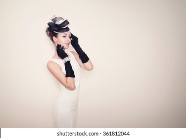 Young Beautiful Lady Dressed In A Proper Outfit For Horse Racing With Hat And Gloves, Fashion On The Field, Vintage Matte Effect