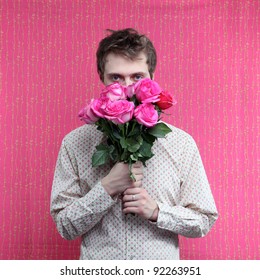 Young Beautiful Man With Flowers