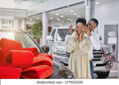 Young And Beautiful Married Couple In Cars Showroom, Confident Black Man Buy New Car As A Present For His Wife