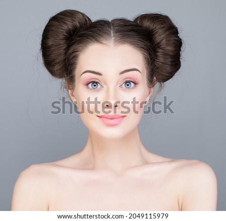Young beautiful model woman with fashion makeup on bright pink background