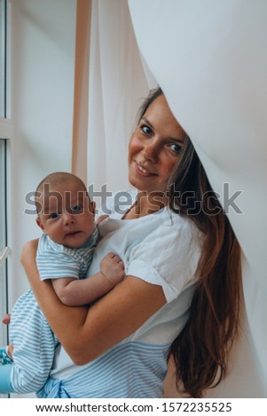 Similar – Image, Stock Photo Mother giving bottle to her newborn