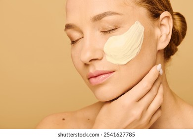 A young, beautiful plus size woman enjoys a soothing facial mask while relaxing. - Powered by Shutterstock