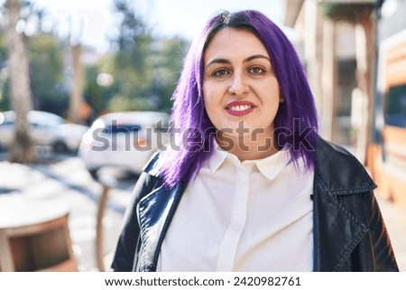 Young beautiful plus size woman smiling confident standing at street