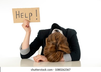 young beautiful red haired caucasian business woman overwhelmed and desperate holding a help sign. looking Stressed, bored, frustrated, upset and unhappy at work. business frustration concept.