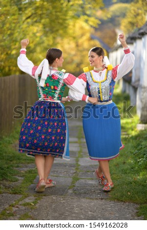 Young beautiful slovak girls in traditional costume